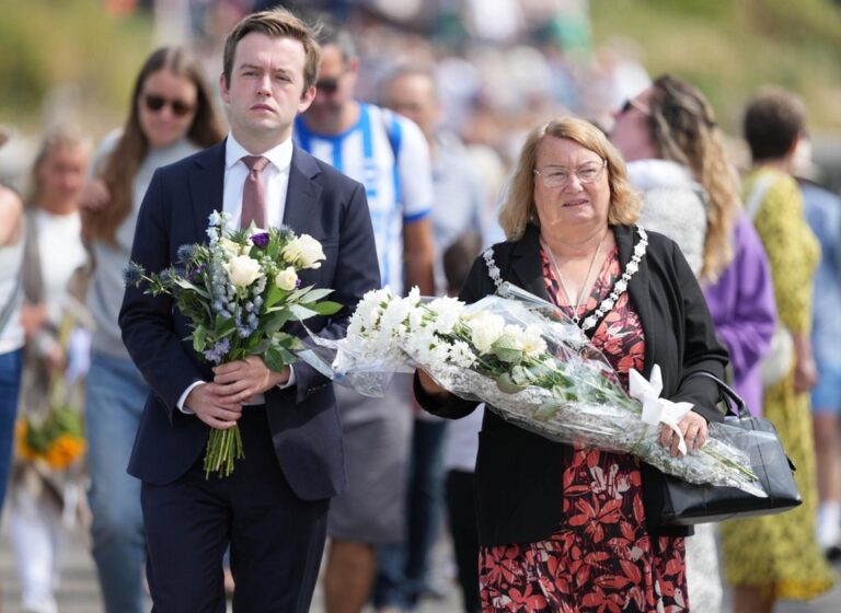 Tom Rutland MP for East Worthing and Shoreham and Cllr Adrienne Lowe, Chair of the Adur District Council, at the ceremony to mark 10th anniversary of the Shoreham air crash.