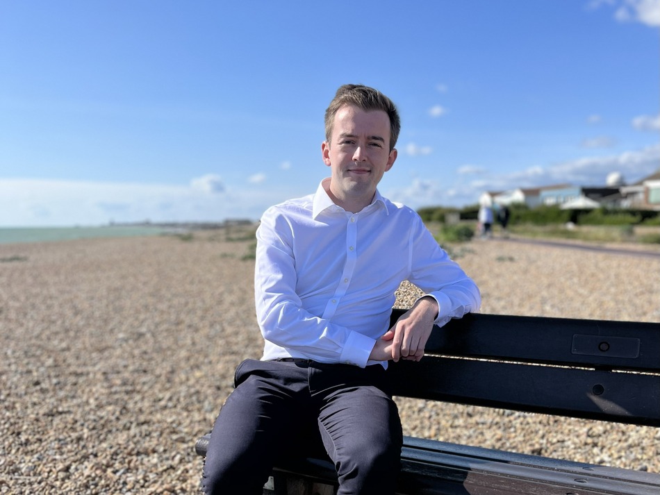 Tom Rutland MP on the beach.